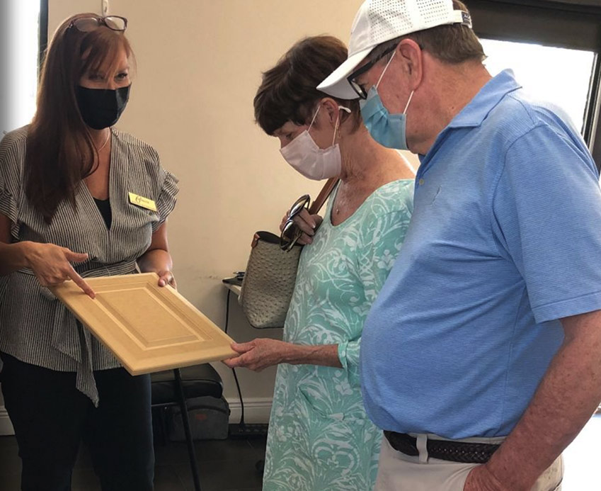 customers looking at cabinet